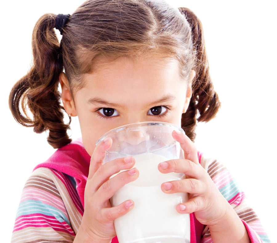 girl drinking a glass of milk
